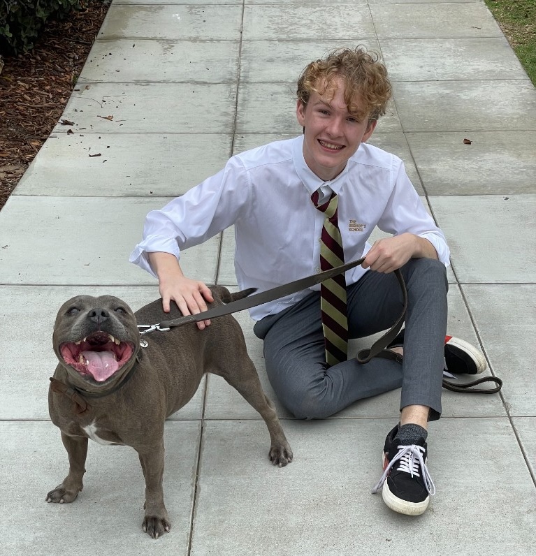 In Bishop’s School uniform with a dog on campus